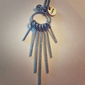 Love on the fringes 30” silvertone necklace.